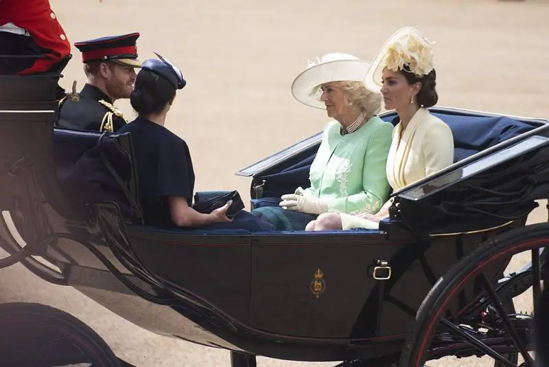 British Royals Camilla, Kate, Meghan, Prince Harry arrive in horse-drawn carriage