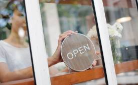 woman-business-owner-open-for-business-sign