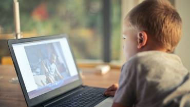 small-boy-using-laptop - Raising Kids in the Digital World: Screen Time Stats &amp; Tips - illustration