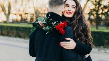 stylish-woman-man-valentines-embracing-in-park