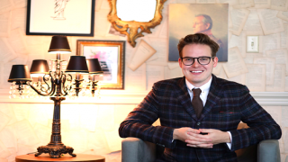Kyle-Taylor-in-Office_0.png
