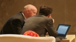 credible man showing client work on laptop_0_0_0.jpg