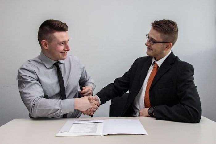 job-candidate-hired-handshake-with-recruitor