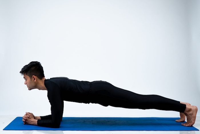 man-doing-plank-yoga-pose