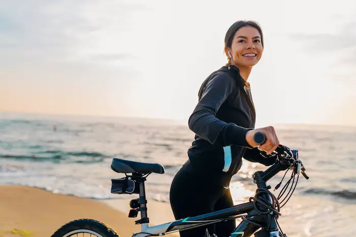 slim-woman-smiling-exercise-riding-bicycle-morning-sunrise-healthy-lifestyle.jpg