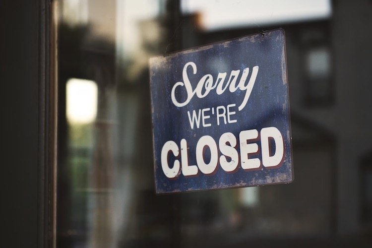 blue and white sorry we are closed wooden signage