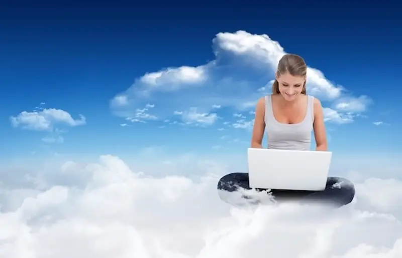 cross-legged-woman-using-laptop-sky-clouds-cloud-workspace