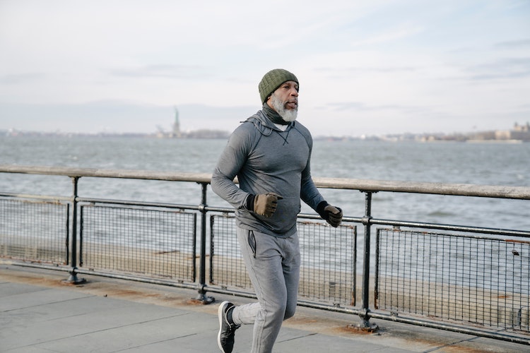 Man-running-beside-sea-exercise-strengthen-bones