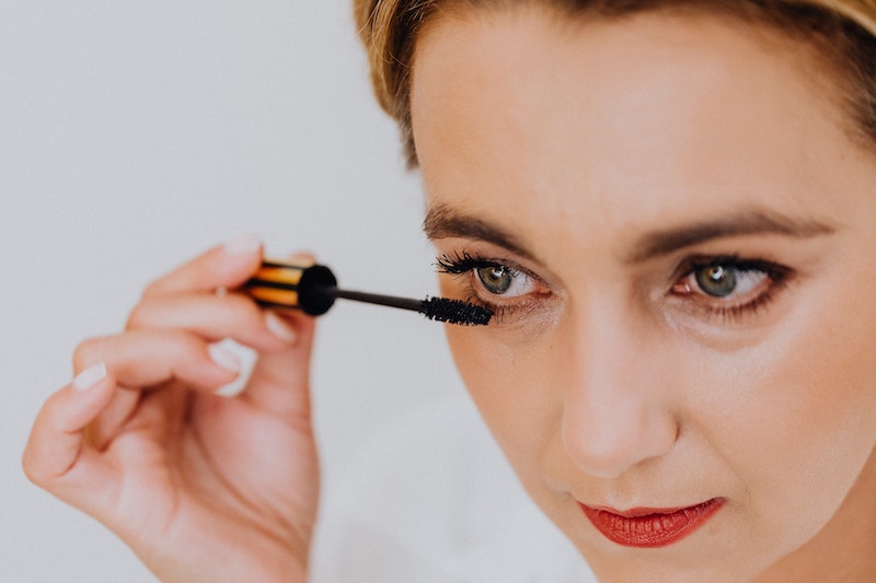 Woman Holding Mascara eyelashes care