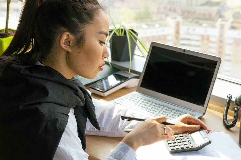 woman-laptop-calculator-development-costs