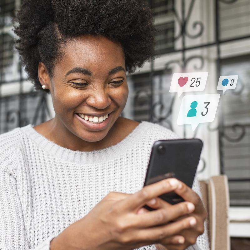 african-american-woman-checking-social-media-phone