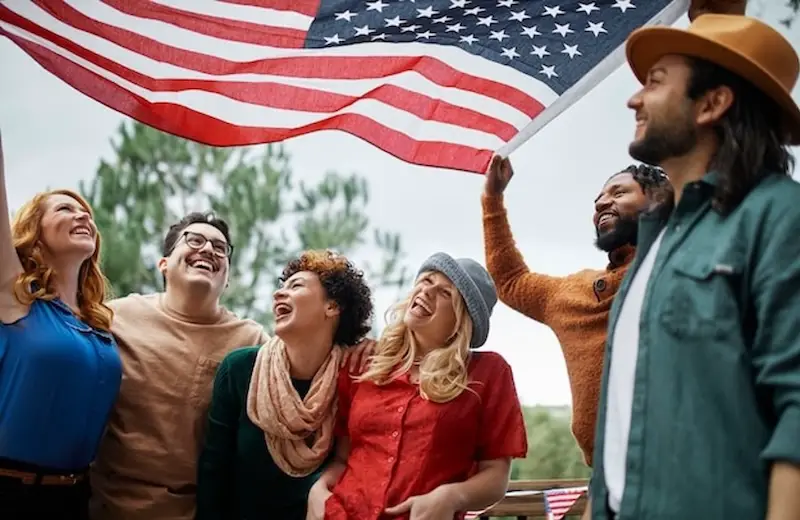 americans-men-women-friends-holiding-us-flag-all-america