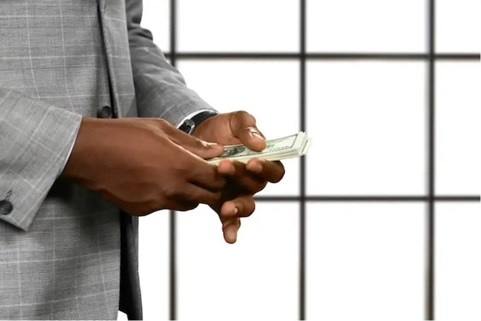 businessman's hands holding money finance business