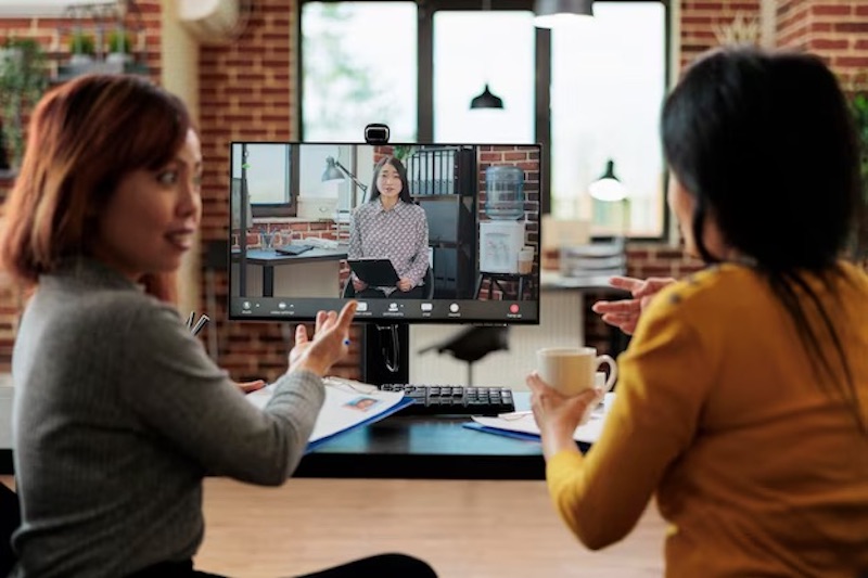 colleagues-collaborating-with-remote-employee-videocall-meeting