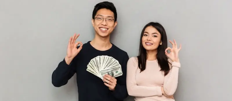 couple-asian-married-holding-dollar-bills-matrimony-credit-myths-facts
