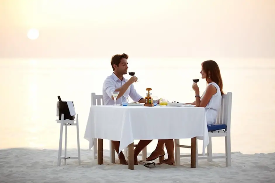 couple-romantic-getaway-experience-beach-dinner-drinking-wine