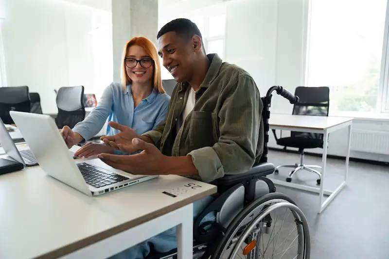 disabled-man-wheelchair-working-his-office-NDIS-clients-digital-marketing