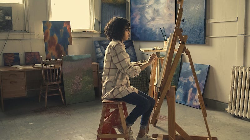 female-creative-artist-paint-workspace