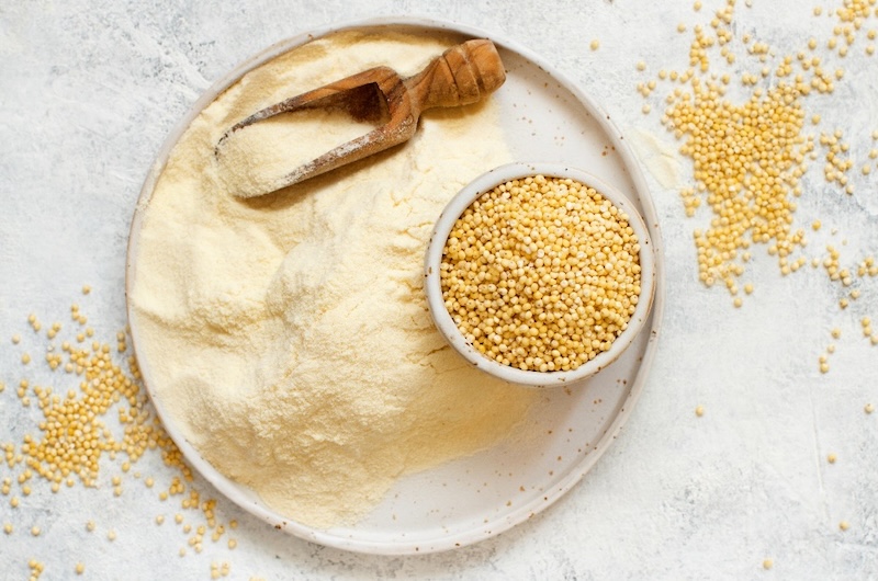 ground-millet-seeds-on-white-surface