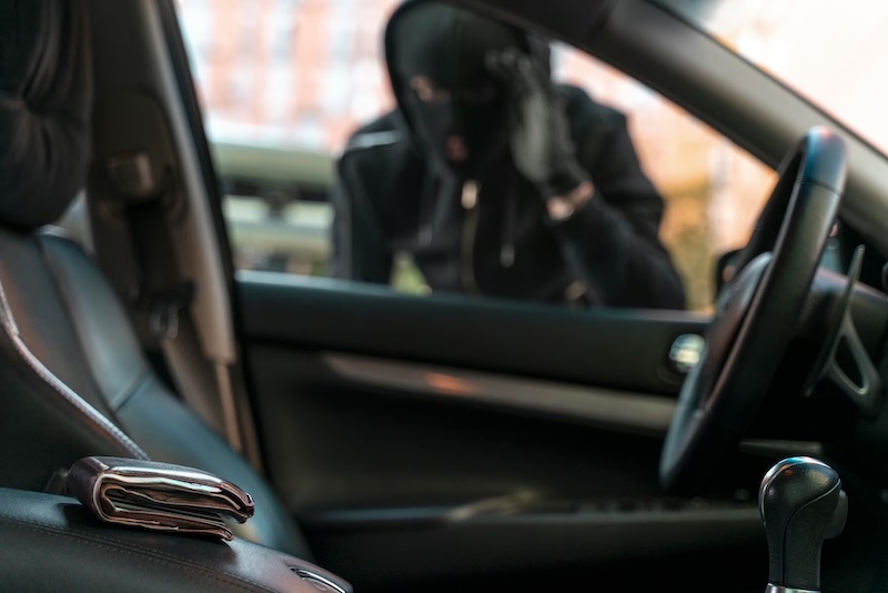 man-trying-break-into-car-safety