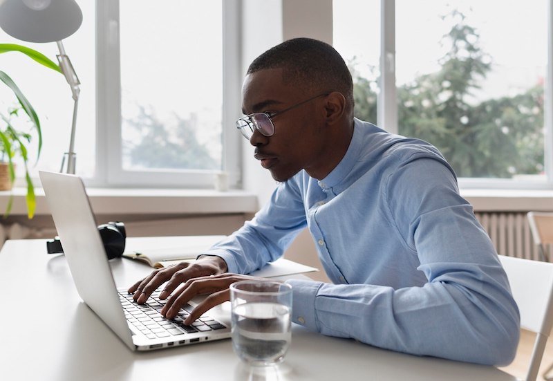 man-working-laptop-workspace-content-writer