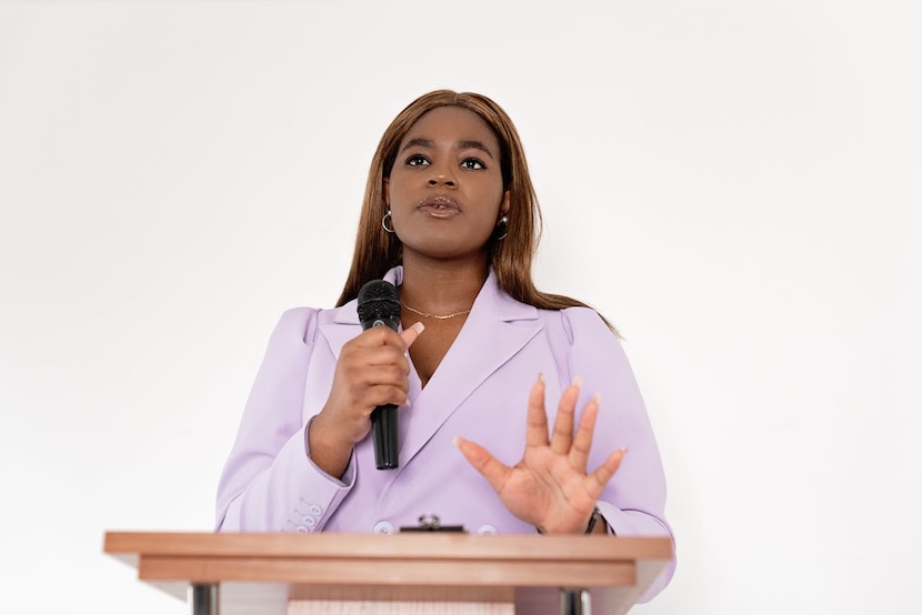 woman-giving-speech-in-meeting