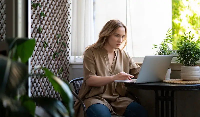 woman-working-on-laptop-hiring-freelancer