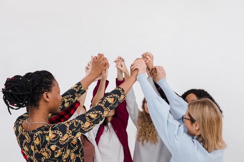 women-friends-holding-hands-gender-gap