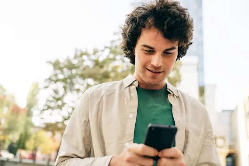 young-man-student-using-mobile-phone-money-saving-app