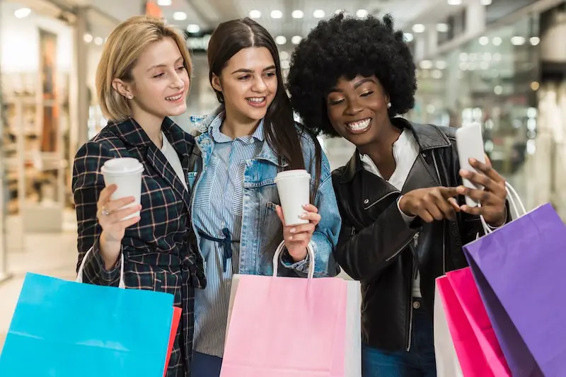 young-women-shopping-bags-saving-money