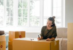 woman packing moving back home from independence to family life