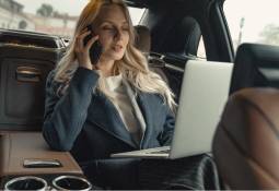 businesswoman-car-backseat-laptop-working-business-travel