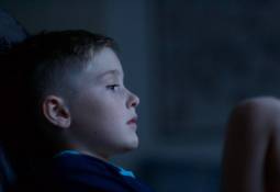 child-pensive-mood-dark-background