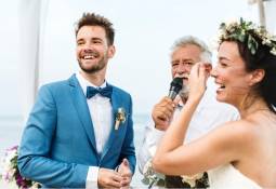 couple-next-to-elderly-man-giving-wedding-speech