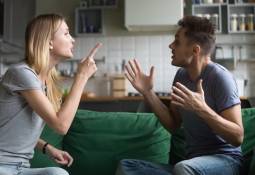 couple_arguing_at_home_on_cauch