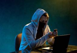 hooded-hacker-laptop-cybersecurity