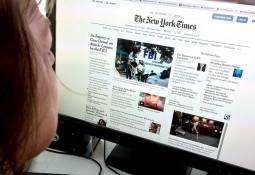 person-using-desktop-computer-reading-news-on-internet-source-of-news