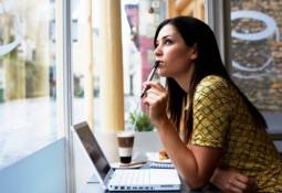woman-looking-ahead-cafe-web-content-specialist