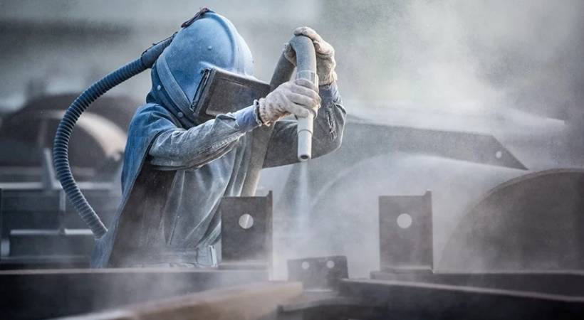 Abrasive blasting operator at work Image for 