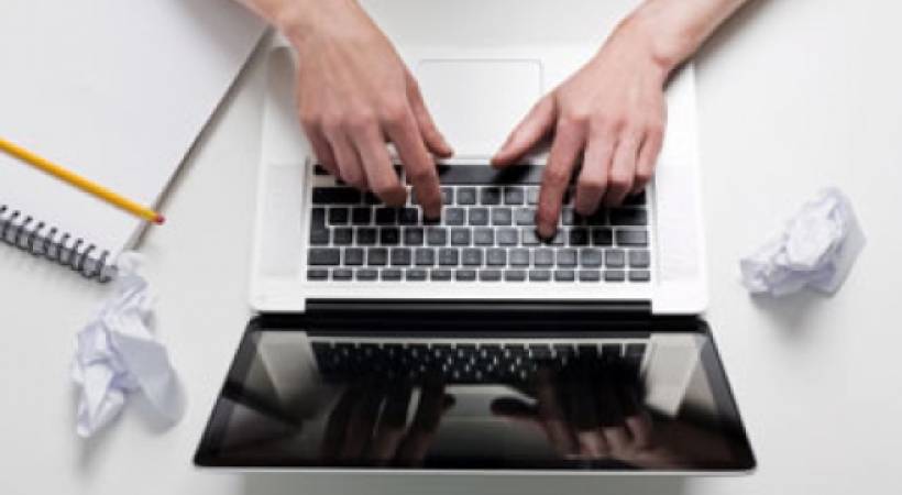 hands-person-typing-on-laptop