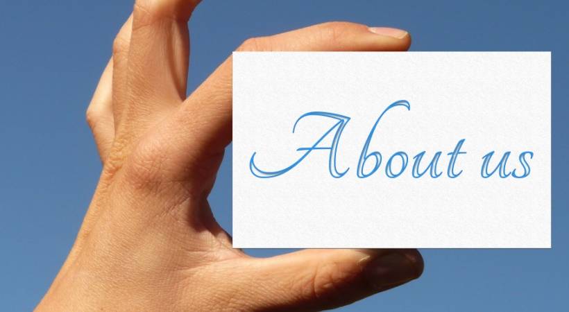 hand-holding-up-card-written-about-us-sky-background-wws