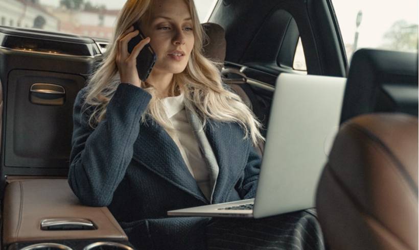 businesswoman-car-backseat-laptop-working-business-travel