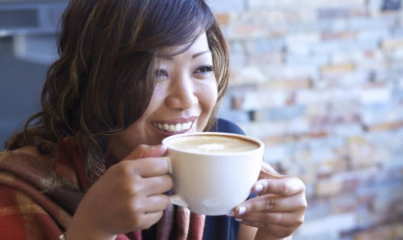 woman-smiley-sipping-classic-coffee