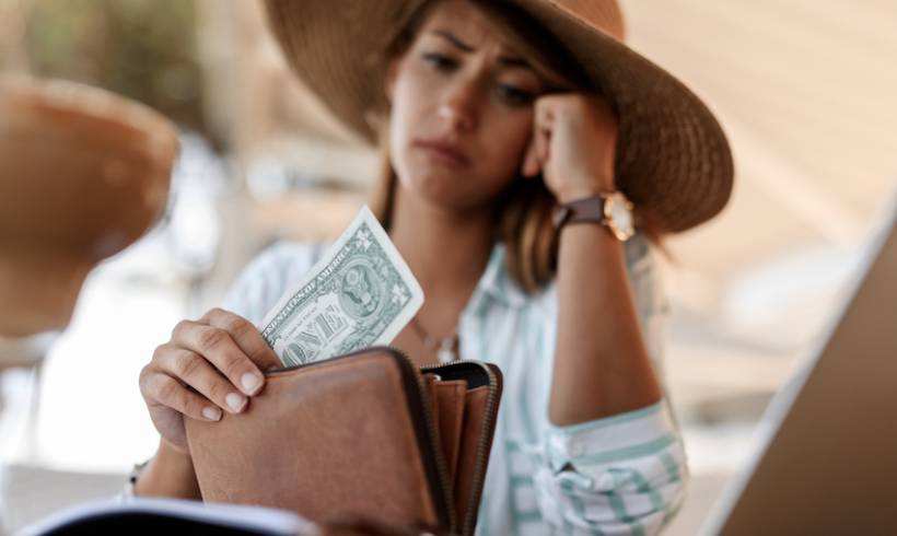 Woman Worried One Dollar Bill in Wallet Bankruptcy Signs Image for Bankruptcy Barometer - 5 Signs You Might Be Headed for Bankruptcy