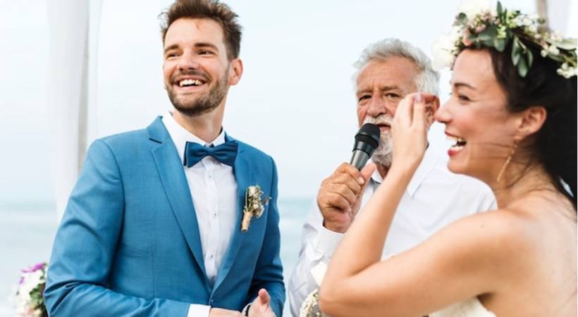 couple-next-to-elderly-man-giving-wedding-speech