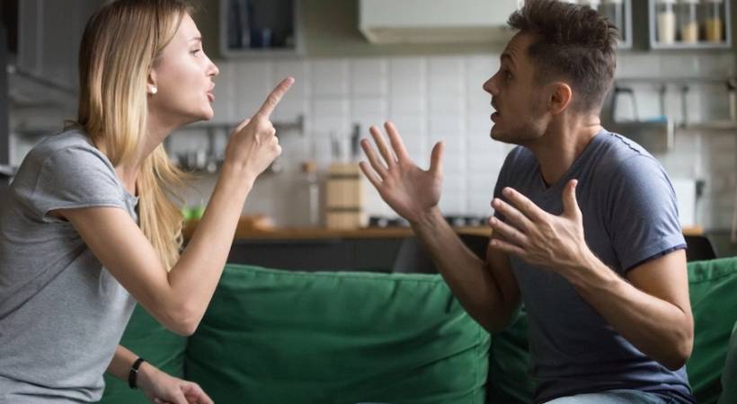couple_arguing_at_home_on_cauch