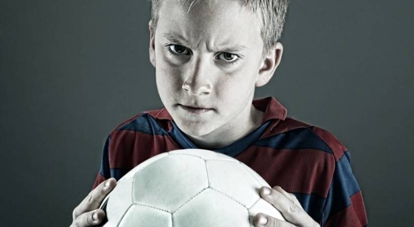 boy-holding-soccer-ball-disruptive-mood-dysregulation-disorder