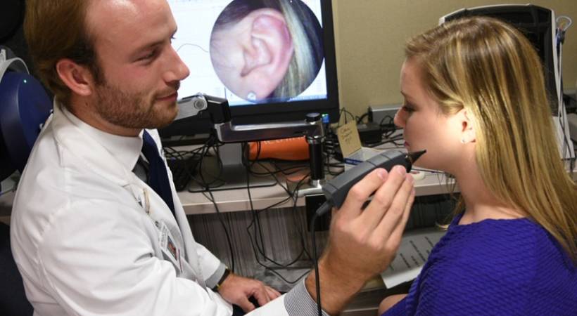 doctor-of-audiology-attending-to-female-patient