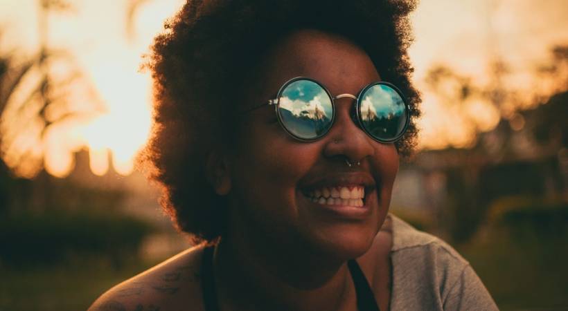 happy-woman-glases-sunset-successful-productive