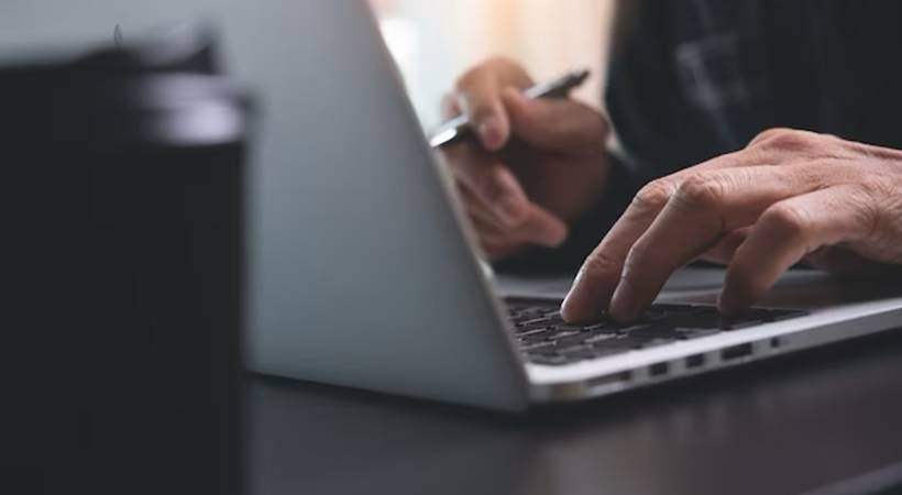 man hands typing on laptop computer web writing